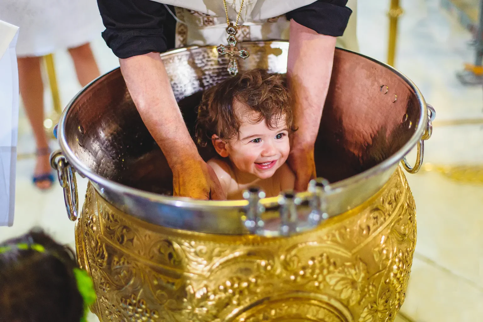 a child in a gold bowl