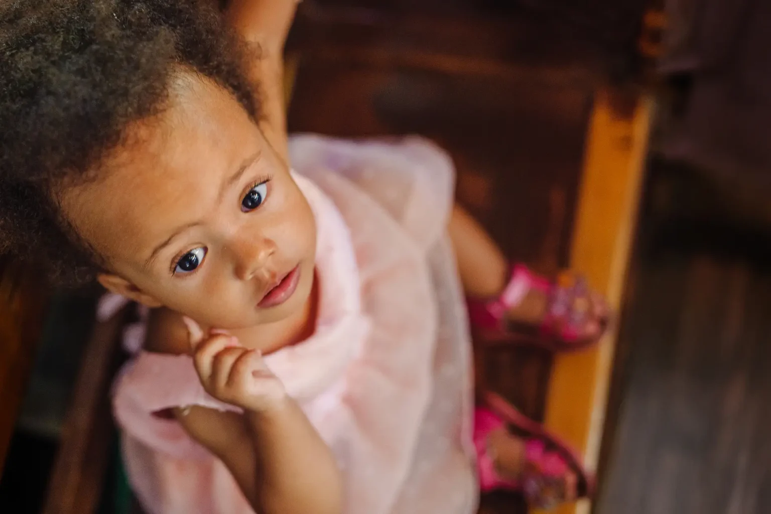 a child in a pink dress