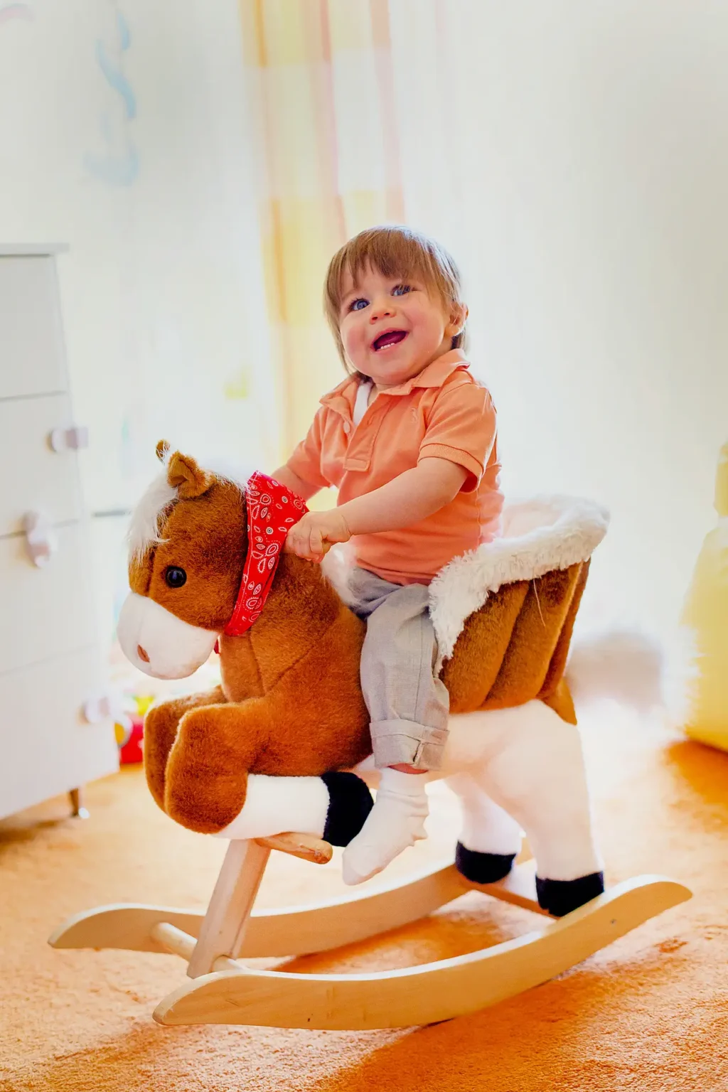 a child riding a toy horse