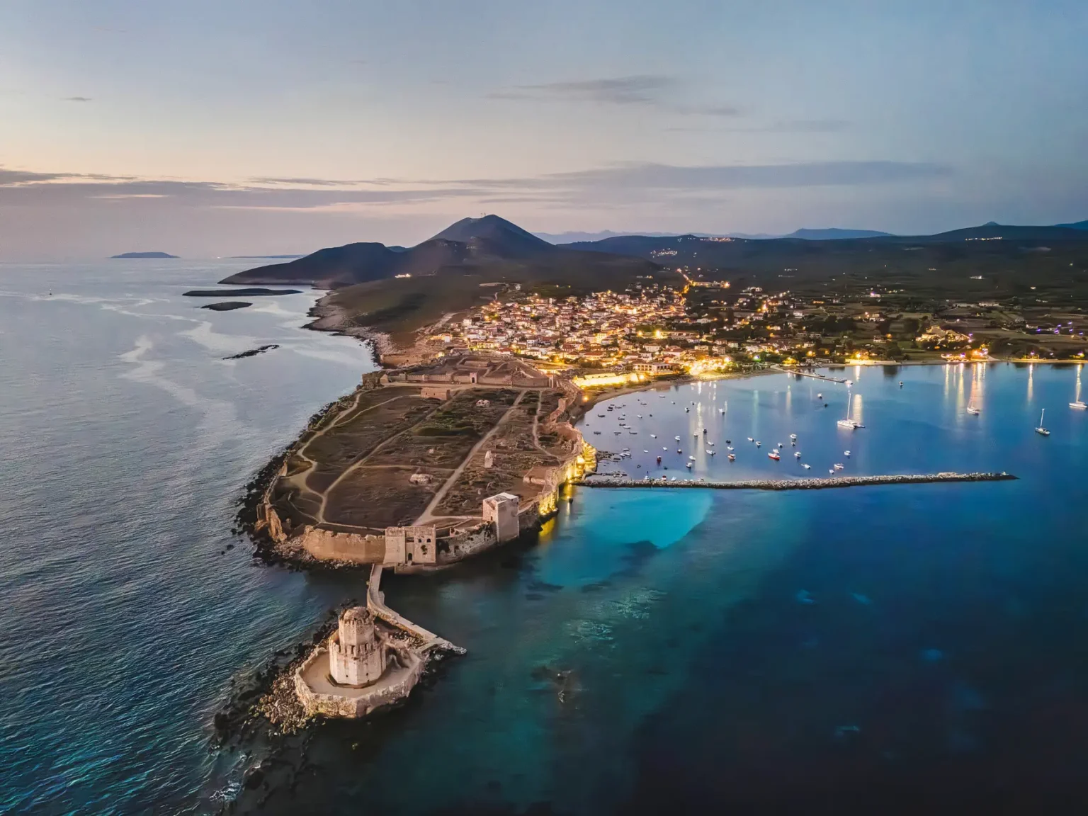 an aerial view of a city and a body of water